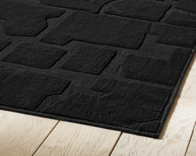 Gibbswell Washable 5' x 7' Area Rug - Furniture World