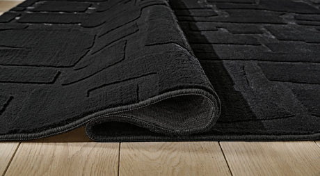 Gibbswell Washable Area Rug - Furniture World