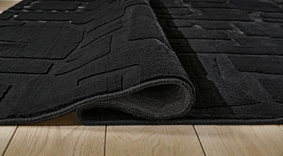 Gibbswell Washable 5' x 7' Area Rug - Furniture World