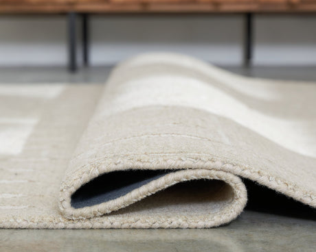 Wolbert 7'8" x 10' Area Rug - Furniture World